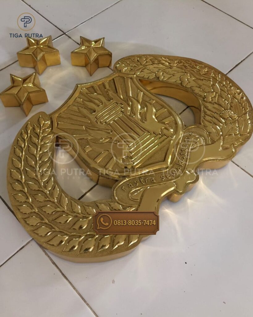 kerajinan tembaga logo tribrata custom dari kuningan